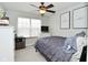 Bright bedroom with a ceiling fan and two inspirational art prints at 10764 Northhampton Dr, Fishers, IN 46038