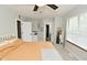 Bright bedroom featuring a ceiling fan, closet, and an additional room entrance at 10764 Northhampton Dr, Fishers, IN 46038