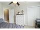 Bedroom featuring a white dresser, neutral carpet, and two closets at 10764 Northhampton Dr, Fishers, IN 46038
