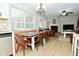Open-concept design with dining area and a cozy living room with fireplace, perfect for entertaining at 10764 Northhampton Dr, Fishers, IN 46038