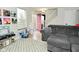 Living room featuring a view of vinyl records, stairs and a gray sectional at 10764 Northhampton Dr, Fishers, IN 46038