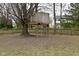 Backyard featuring a custom-built treehouse, creating a fun and adventurous space at 10764 Northhampton Dr, Fishers, IN 46038