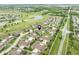 Scenic view of a beautiful residential area with pond, golf course, and lush greenery at 11438 Winding Wood Dr, Indianapolis, IN 46235