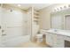 Bathroom with a shower-tub combo, white cabinets, and recessed lighting at 11438 Winding Wood Dr, Indianapolis, IN 46235