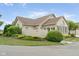 Beautiful single-story brick home with mature landscaping, quaint fence and attached front sunroom at 11438 Winding Wood Dr, Indianapolis, IN 46235