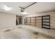Spacious garage with shelving units and ample storage space for vehicles and equipment at 11438 Winding Wood Dr, Indianapolis, IN 46235