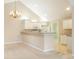 Bright kitchen with white appliances and open layout at 11438 Winding Wood Dr, Indianapolis, IN 46235