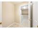 Bright laundry room featuring tile flooring, storage shelves, and a modern washer and dryer at 11438 Winding Wood Dr, Indianapolis, IN 46235