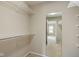 Walk-in closet with wire shelving and carpet flooring at 11438 Winding Wood Dr, Indianapolis, IN 46235
