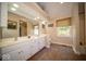 Elegant bathroom with a large mirror, double sinks, plenty of counter space, and tile flooring at 11536 Woods Bay Ln, Indianapolis, IN 46236