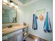 Bright bathroom featuring a custom vanity and stylish decor at 11536 Woods Bay Ln, Indianapolis, IN 46236