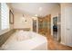 Spa-like bathroom featuring a jacuzzi tub and tiled walk-in shower at 11536 Woods Bay Ln, Indianapolis, IN 46236