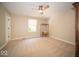 Spacious bedroom with neutral tones, a ceiling fan, ample lighting, and soft carpeting for a cozy feel at 11536 Woods Bay Ln, Indianapolis, IN 46236