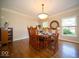 This dining room features wood floors and lots of natural light at 11536 Woods Bay Ln, Indianapolis, IN 46236