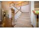 Grand foyer features a staircase, wood and carpet floors, and a view to other rooms at 11536 Woods Bay Ln, Indianapolis, IN 46236