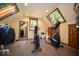 Bright and spacious gym featuring updated exercise equipment and natural light from skylights and windows at 11536 Woods Bay Ln, Indianapolis, IN 46236
