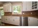 This kitchen has granite countertops, stainless appliances and wood floors at 11536 Woods Bay Ln, Indianapolis, IN 46236