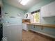 Laundry room with washer, dryer and countertop workspace at 11536 Woods Bay Ln, Indianapolis, IN 46236