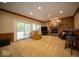 Inviting living room with a brick fireplace and sliding glass doors to the outdoors at 11536 Woods Bay Ln, Indianapolis, IN 46236