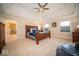 Spacious main bedroom featuring a tray ceiling and an ensuite bathroom at 11536 Woods Bay Ln, Indianapolis, IN 46236
