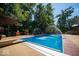 Backyard pool with diving board, water features, and lounge area at 11536 Woods Bay Ln, Indianapolis, IN 46236