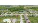 Aerial view of a residential neighborhood with homes, green spaces, a pool and a pond at 12052 Northface Dr, Noblesville, IN 46060