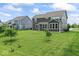 Large backyard with lush green grass and landscaping, perfect for outdoor activities at 12052 Northface Dr, Noblesville, IN 46060