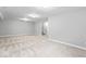 Bright and spacious basement area boasts neutral carpeting, paint, and white trim at 12052 Northface Dr, Noblesville, IN 46060