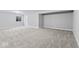 Expansive basement area showcases neutral carpeting, paint, and white trim at 12052 Northface Dr, Noblesville, IN 46060