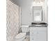 Cozy bathroom with a shower curtain, vanity, and a tiled floor at 12052 Northface Dr, Noblesville, IN 46060
