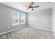 Bedroom featuring neutral carpet, ceiling fan, and large windows for plenty of natural light at 12052 Northface Dr, Noblesville, IN 46060