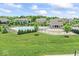 A community pool offers residents recreation with manicured landscaping and neighborhood homes in the background at 12052 Northface Dr, Noblesville, IN 46060
