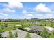 Aerial view of a community with a playground, pool, and pond at 12052 Northface Dr, Noblesville, IN 46060