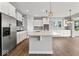 Open kitchen features island, stainless appliances, pantry and eat in nook at 12052 Northface Dr, Noblesville, IN 46060