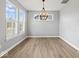 Bright and airy room with lots of natural light, wood-look floors, and plantation shutters at 12052 Northface Dr, Noblesville, IN 46060