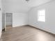 Bedroom with hardwood-style floors and view of an ensuite bathroom with shower at 1225 S Monroe St, Muncie, IN 47302