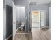 Hallway view leading to a toilet and a room with doors and hardwood style floors at 1225 S Monroe St, Muncie, IN 47302