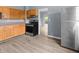 An eat-in kitchen area features stainless steel appliances and light wood cabinetry at 1225 S Monroe St, Muncie, IN 47302