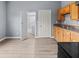 An eat-in kitchen area features a doorway into the bathroom and light wood cabinetry at 1225 S Monroe St, Muncie, IN 47302