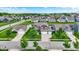 An aerial view of a residential neighborhood with well-maintained homes, green lawns, mature trees, and streetscapes at 1286 Brookdale Ct, Franklin, IN 46131