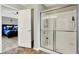 Bathroom featuring a modern glass shower and view into the main bedroom at 1286 Brookdale Ct, Franklin, IN 46131