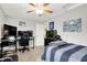 This bedroom features a ceiling fan, gaming desk and chair, and an aquarium, perfect for relaxation and entertainment at 1286 Brookdale Ct, Franklin, IN 46131