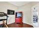 Multi-purpose room with wood-look flooring and a view into another room at 1286 Brookdale Ct, Franklin, IN 46131