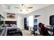 Cozy bedroom features a ceiling fan, double bed with decorative pillows, and a desk with an ergonomic chair for comfort at 1286 Brookdale Ct, Franklin, IN 46131