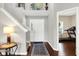 Bright foyer with staircase, hardwood floors, and a view into an adjacent room at 1286 Brookdale Ct, Franklin, IN 46131
