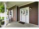 Inviting front porch with rocking chairs, decorative wreath, and charming curb appeal at 1286 Brookdale Ct, Franklin, IN 46131