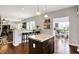 An open-concept kitchen with a center island, breakfast bar, and stylish pendant lighting at 1286 Brookdale Ct, Franklin, IN 46131