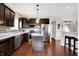 Stylish kitchen with stainless steel appliances, dark cabinets, and ample countertop space at 1286 Brookdale Ct, Franklin, IN 46131