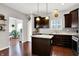 A modern kitchen featuring stainless steel appliances, a center island, and ample cabinet space at 1286 Brookdale Ct, Franklin, IN 46131
