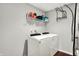A functional laundry room equipped with modern appliances and shelving for storage at 1286 Brookdale Ct, Franklin, IN 46131
